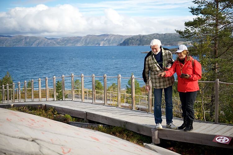 Couple watching rock art